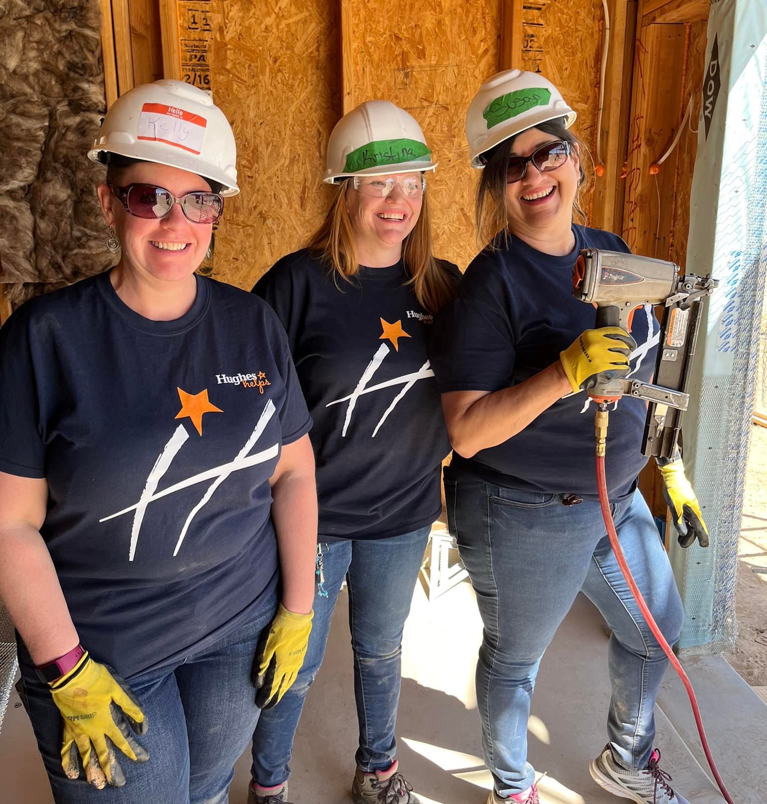 The Hughes Helps team helping with contruction