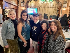 Several people pose at the JA Heroes event