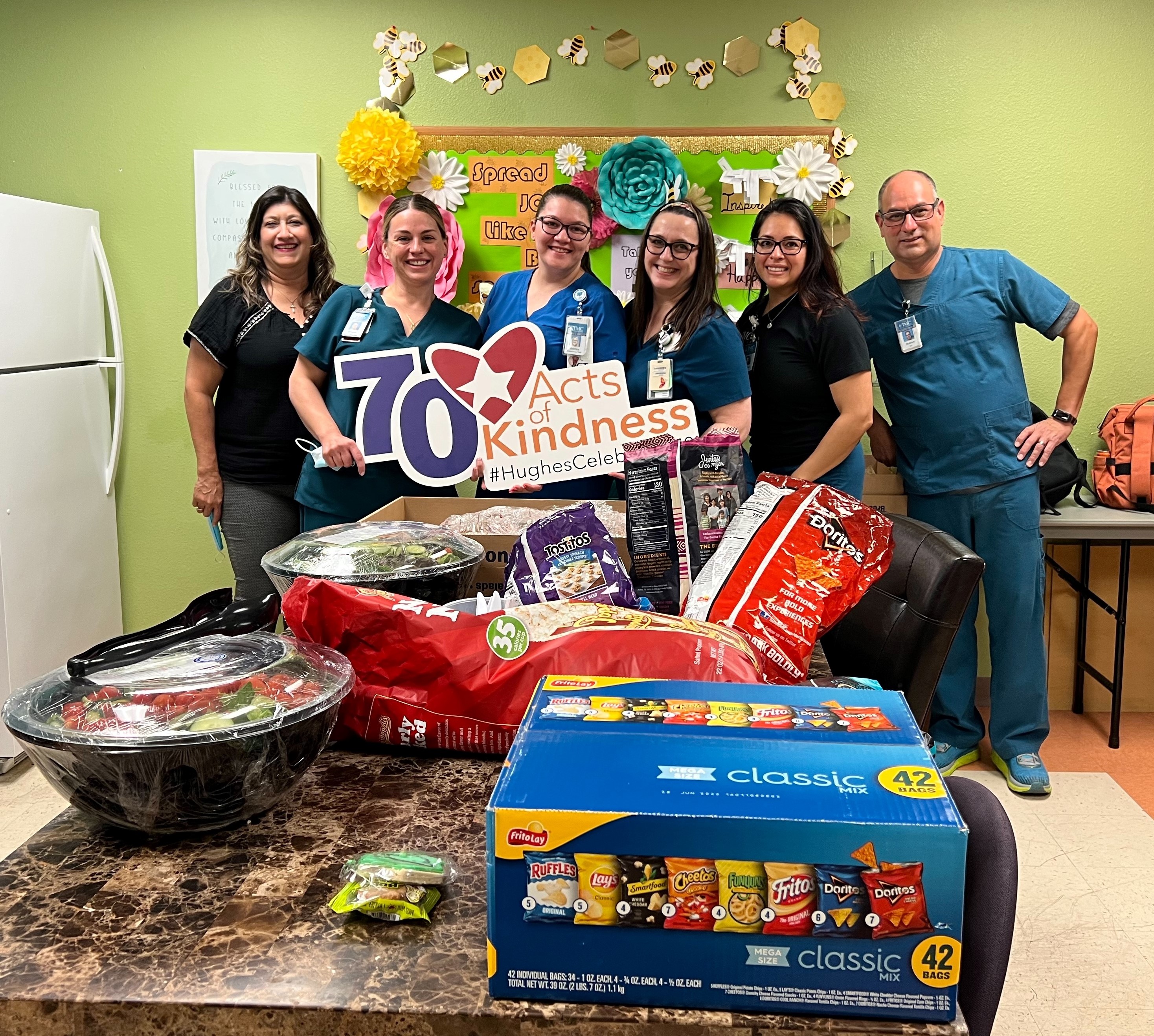 TMC nurses and Hughes staff pose for photo