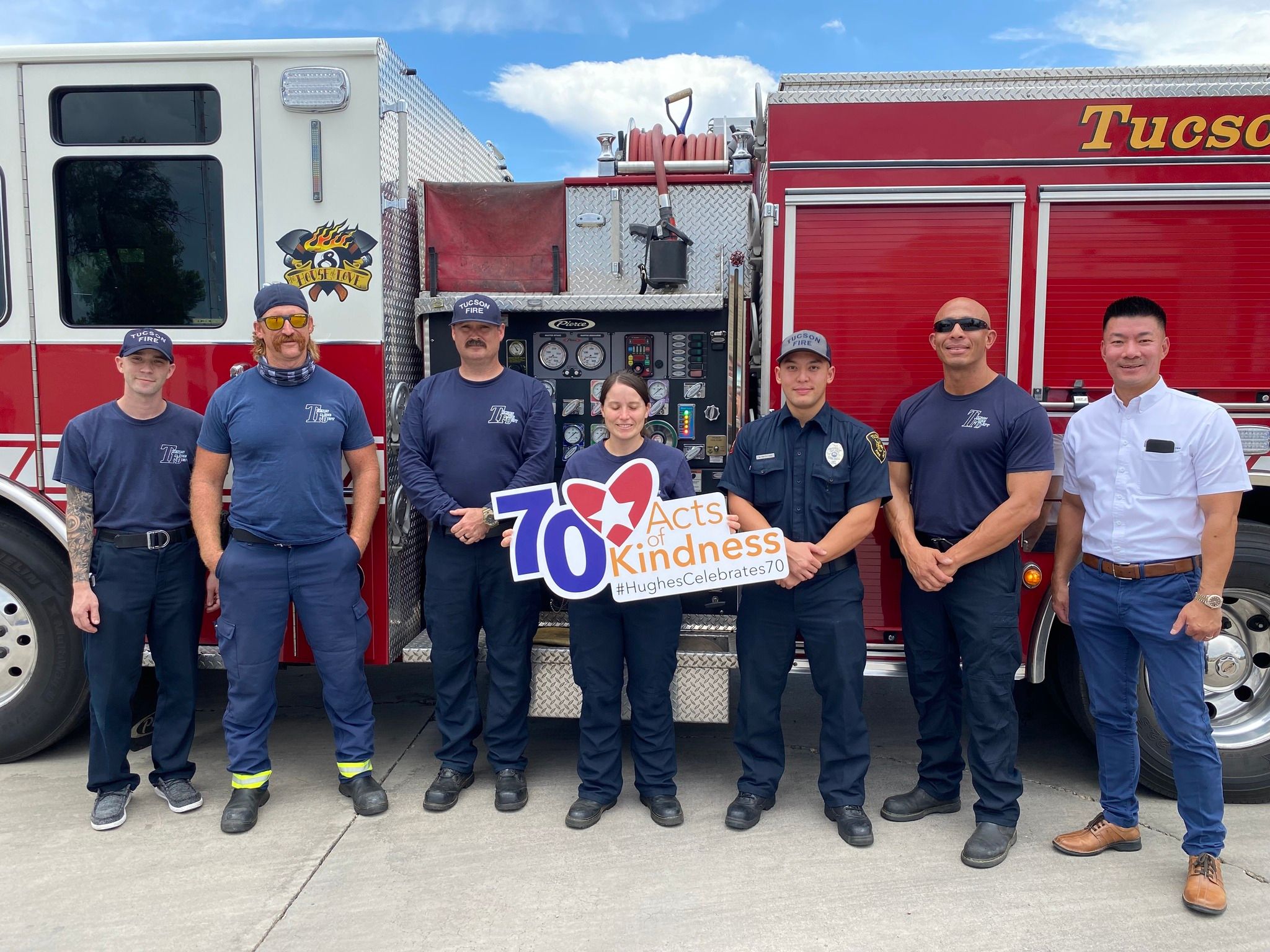 TFD crew posing in front of firetruck