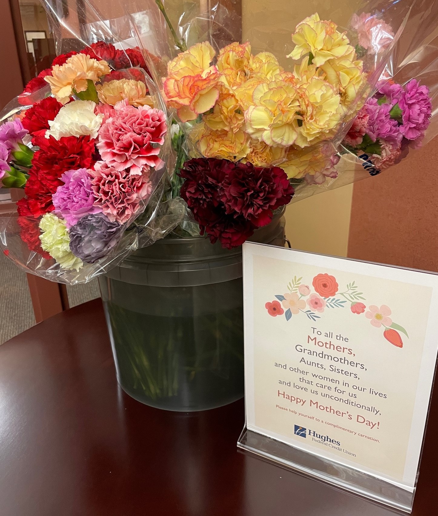 Carnations alongside a mother's day message