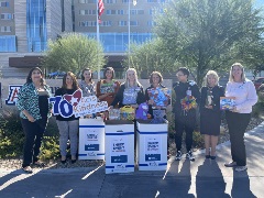 The Hughes team donates toys to Children's Diamond Center