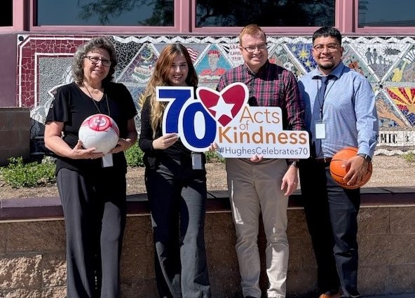 hughes team poses with Challenger Middle school staff