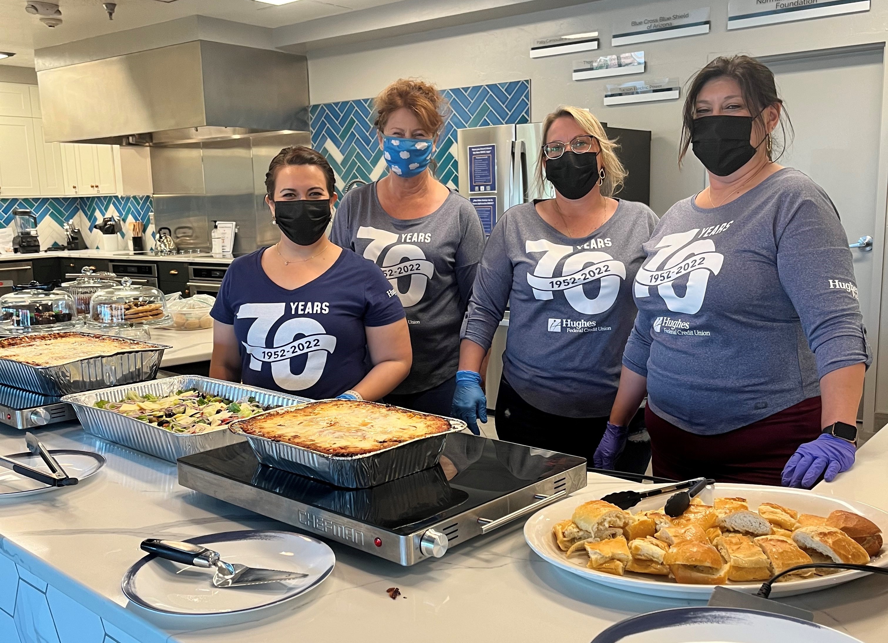 The Hughes Helps team making dinner