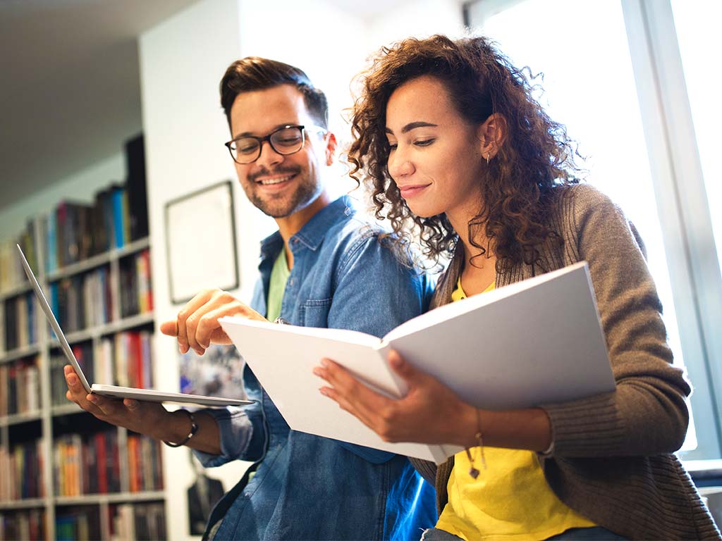 female student with college textbooks